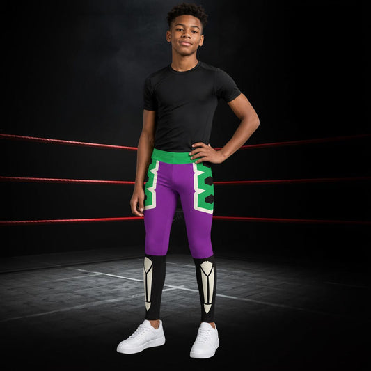 Person wearing a black t-shirt and purple wrestling lucha libre wrestling tights with green accents in a ring.