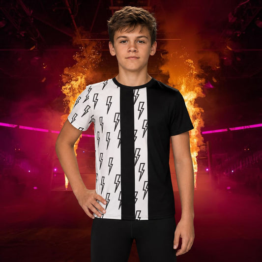 A young male model wearing a black and white t-shirt with a lightning bolt pattern, posed against a dramatic stage background with smoke and fire effects.