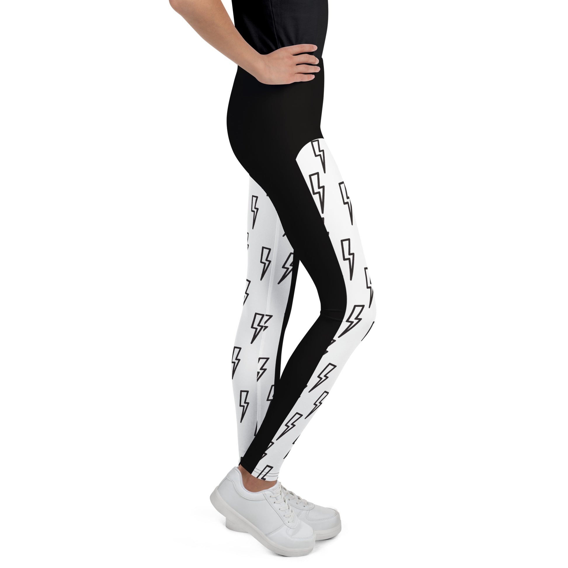 Side view of youth wrestling cosplay leggings with lightning bolt print in black and white