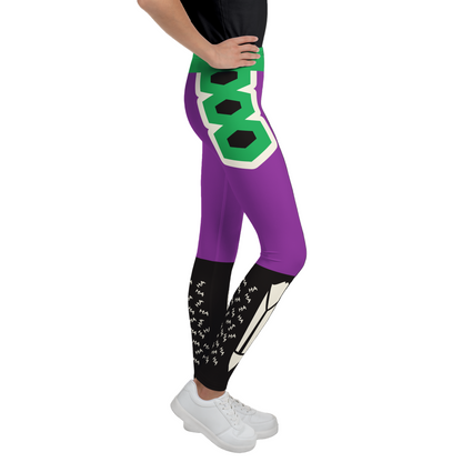 Purple leggings with green and black design. Geometric pattern. Fun ha ha graffiti on shins and spooky skeleton bones at front of legs.