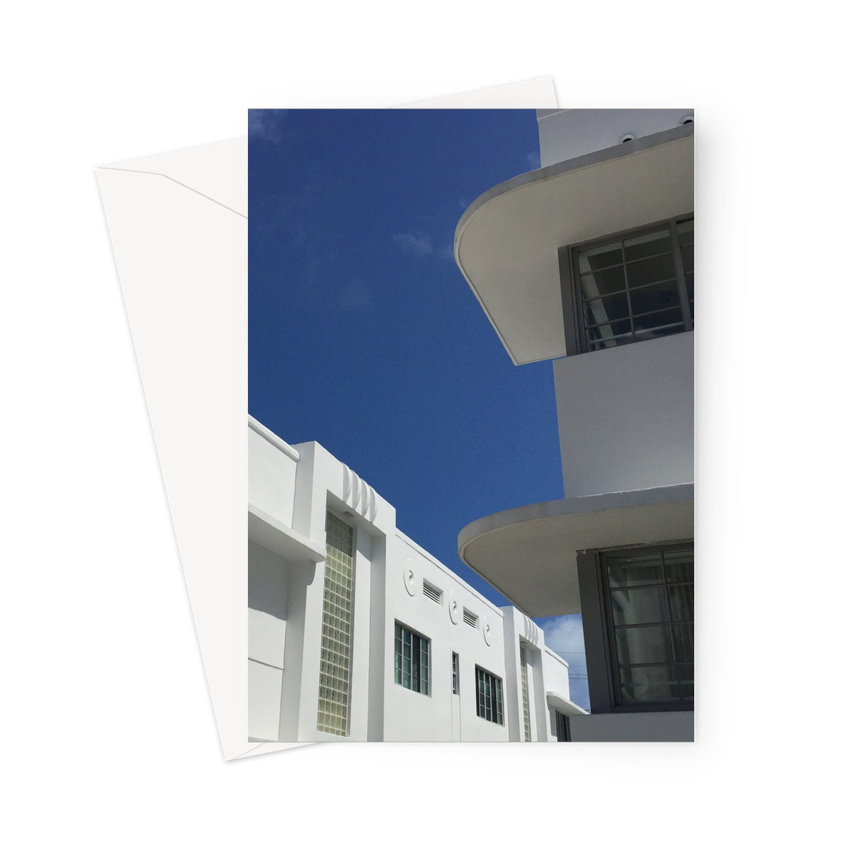This greeting card shows two white Art Deco buildings with geometric shapes and patterning.
