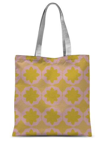 This Mid-Century Modern style tote shopping bag consists of a colorful, abstract geometric floral design in pink and orange tones