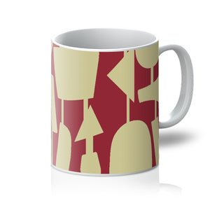 This Mid-Century Modern style ceramic coffee mug mug consists of colorful connected shapes in cream on a vermillion red background