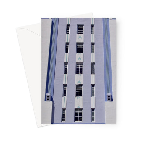 This greeting card shows a tall blue, lilac and white building with geometric patterning.
