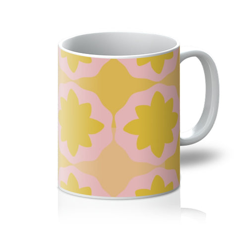 This Mid-Century Modern style mug consists of a colorful, abstract geometric floral design in pink and orange tones