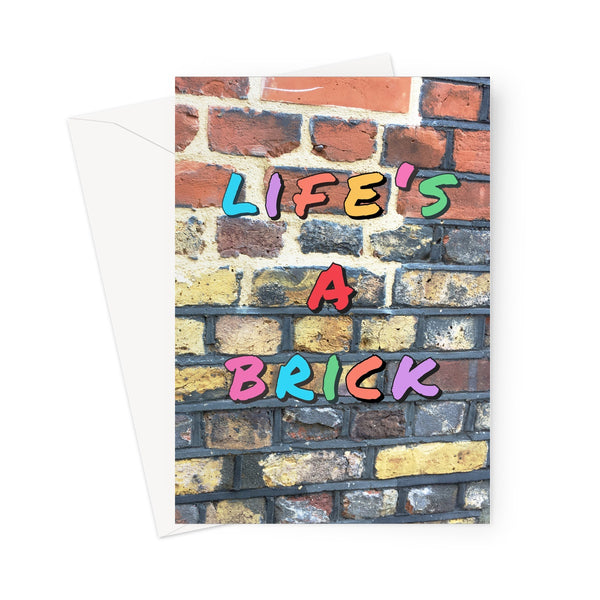This greeting card shows the message "Life's a brick" in multi-colour against a beautiful old brick wall.