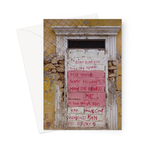 Greeting card showing blocked up doorway that is painted pink and white and covered in red graffiti. The doorway is neo-classical and painted white. The walls of the building are painted a decayed yellow and part of the wall is exposing the underlying stonework