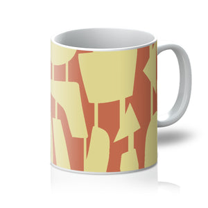 This Mid-Century Modern style ceramic coffee mug consists of colorful connected shapes in yellow on an orange background