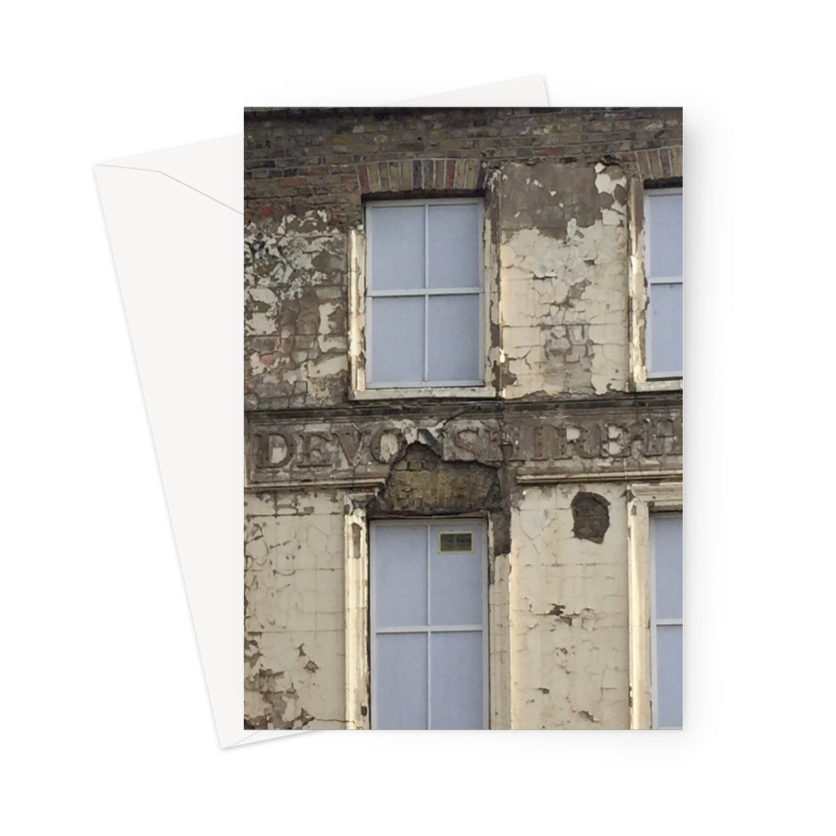 Closeup of Devonshire House in Southwark, pre-restoration, showing broken plasterwork and peeling paint in this greeting card