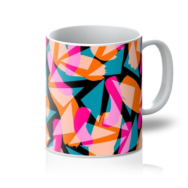 Geometric and abstract patterned ceramic mug in tones of pink, orange, turquoise and white against a black background by BillingtonPix