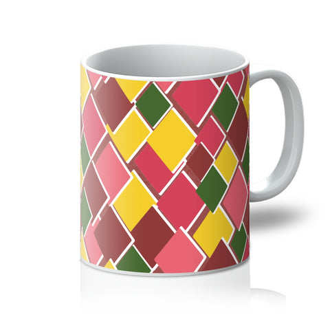 Kitsch 69s style harlequin diamond patterned coffee mug in tones of citrus, leaf green, peach and raspberry in an irregular diamond shaped pattern. 