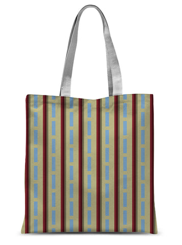 This shopping tote bag has a vintage style patterned design of vermilion red and cerulean blue stripes against a cream background with white handles