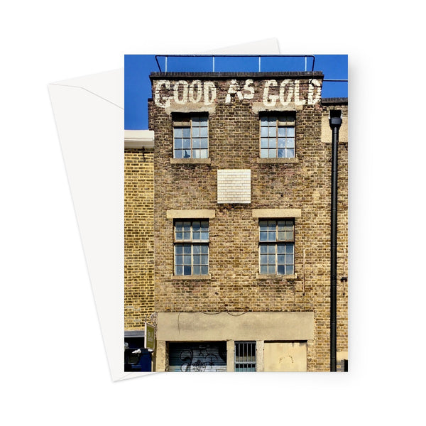 Greeting card showing a period Southwark building with the phrase "Good as Gold" painted in white capital letters at the very top. This tall building has two floors and four sets of old Georgian windows. Graffiti is also painted on the groundfloor frontage.