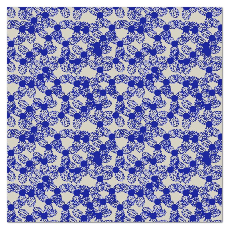 The patterned kitchen tablecloth has an abstract floral pattern in a blue dotted outline against a pale grey background
