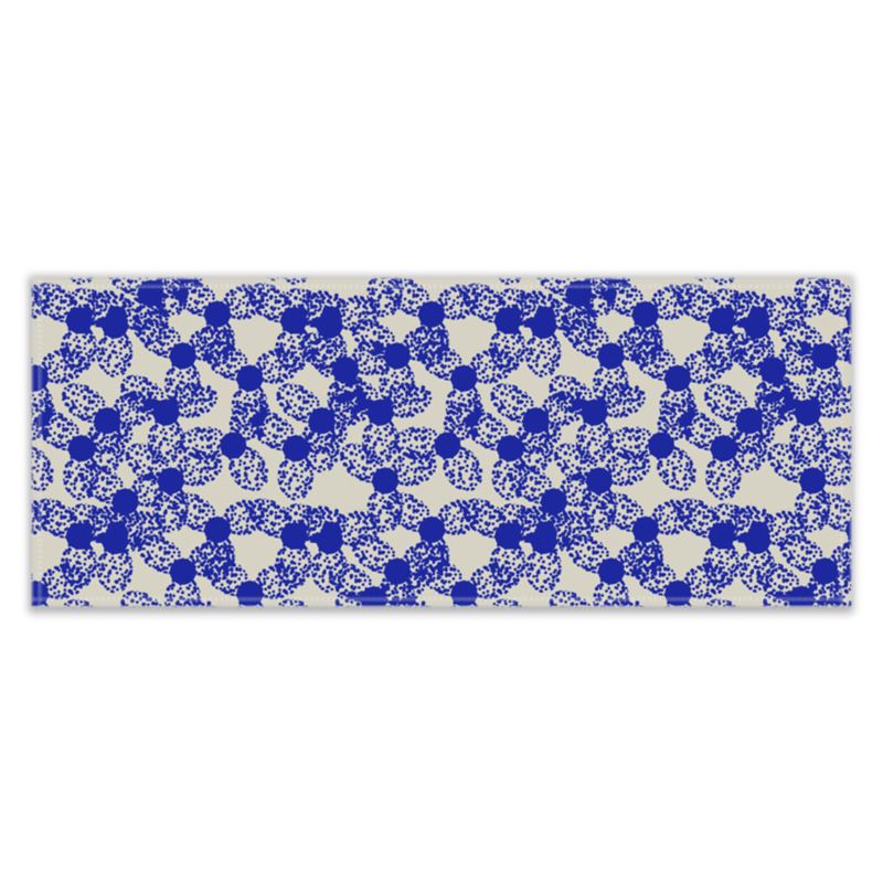 This patterned retro style design has an abstract dotted floral repeat pattern in blue against a pale grey background.