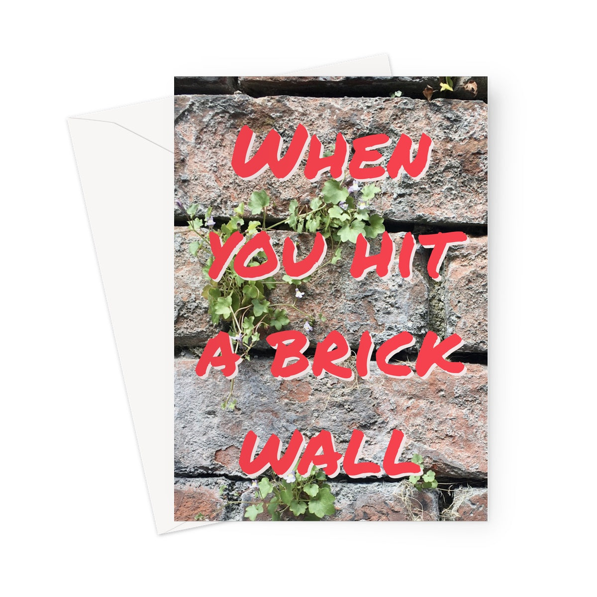 This greeting card shows the words "When you hit a brick wall" in red in front of a closeup of old bricks.