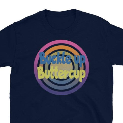 Funny meme t-shirt with the meme Buckle up Buttercup in blue and yellow font against a concentric circular design on this navy cotton t-shirt by BillingtonPix