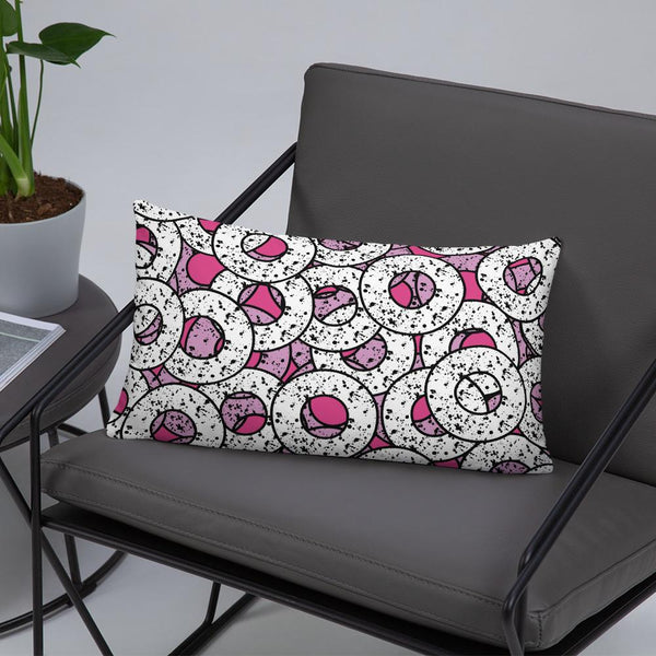 Gorgeous, fun Pink 80s Memphis style sofa cushion or couch pillow from our Splattered Donuts Collection 20x12 featuring a bold pattern of pink and white sprinkled donuts, or maybe they are paint splatters lifestyle image