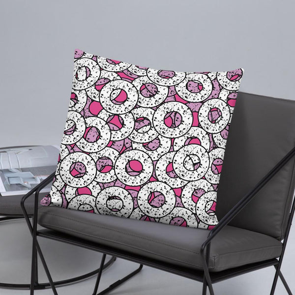  Gorgeous, fun Pink 80s Memphis style sofa cushion or couch pillow from our Splattered Donuts Collection 22x22 featuring a bold pattern of pink and white sprinkled donuts, or maybe they are paint splatters - lifestyle image
