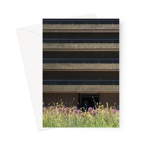 Parallel horizontal lines of the Barbican, London with colourful flowers in the bottom foreground of this greeting card