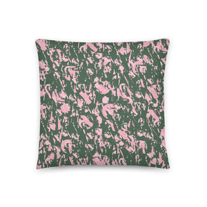 Sage green and pastel pink abstract patterned sofa cushion or couch pillow with hints of 90s Memphis style design.