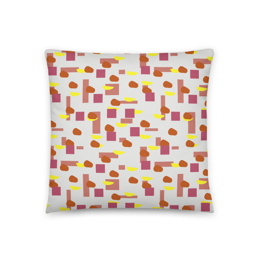 50s style Mid Century Modern geometric shapes in retro tones of pink, crimson, orange and yellow against a cream background on this throw cushion by BillingtonPix