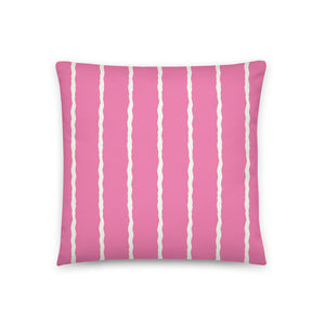This Mid-Century Modern style scatter cushion consists of jagged vertical pale cream stripes against a powder pink background