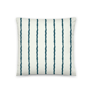 This Mid-Century Modern style scatter cushion consists of jagged vertical teal blue stripes against a pale cream background