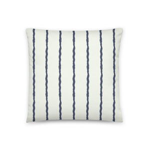 This Mid-Century Modern style scatter cushion consists of jagged vertical navy blue stripes against a pale cream background