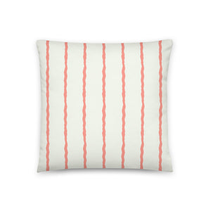This Mid-Century Modern style scatter cushion consists of jagged vertical salmon pink stripes against a pale cream background