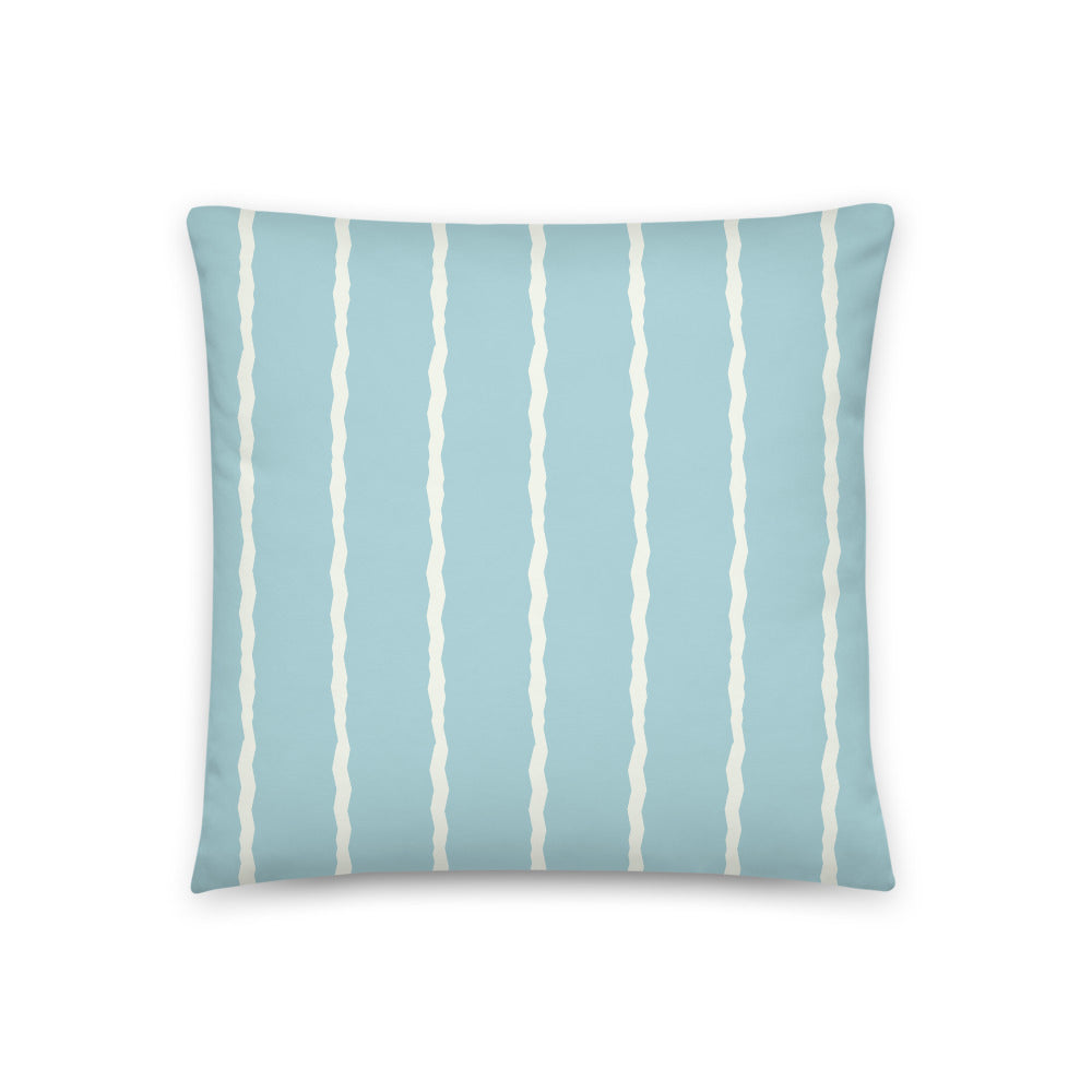 This retro style scatter cushion consists of jagged vertical pale cream stripes against a seafoam blue background