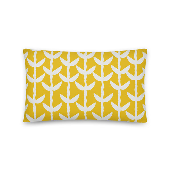 This striking Mid-Century Modern style couch pillow design consists of a series of cream coloured leaves and stems against a mustard yellow background