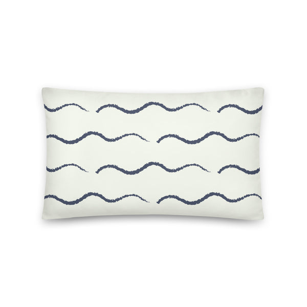 This Mid-Century Modern style couch pillow design consists of a series of horizontal navy blue wave shapes against a pale cream background