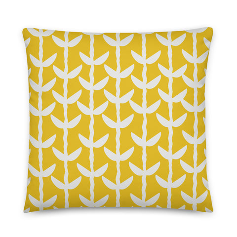 This striking Mid-Century Modern style couch pillow design consists of a series of cream coloured leaves and stems against a mustard yellow background