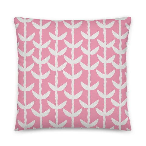 This striking Mid-Century Modern style couch pillow design consists of a series of cream coloured leaves and stems against a soft pink background