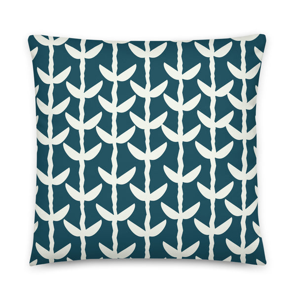 This striking Mid-Century Modern style couch pillow design consists of a series of cream coloured leaves and stems against a blue-green teal background