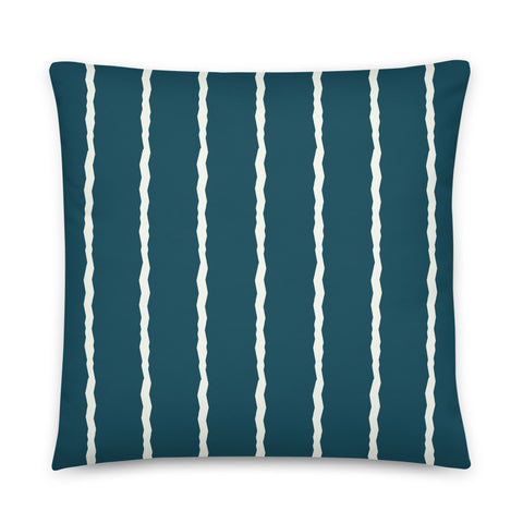 This Mid-Century Modern style scatter cushion consists of jagged vertical pale cream stripes against a blue teal background