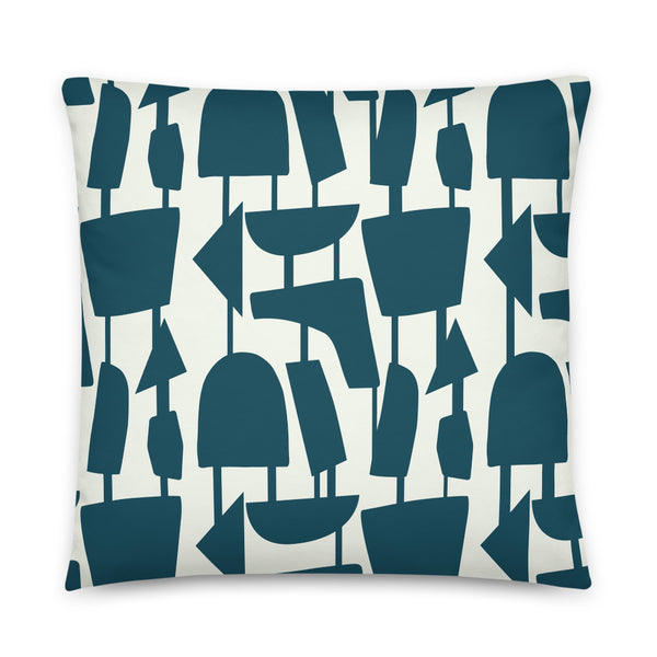 This Mid-Century Modern style scatter cushion consists of blue teal geometric shapes, connected by narrow tentacles to form and almost hanging mobile type abstract pattern on a pale cream background