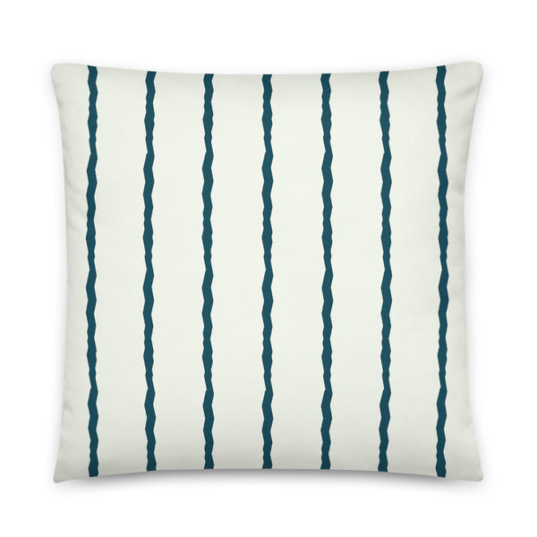 This Mid-Century Modern style scatter cushion consists of jagged vertical teal blue stripes against a pale cream background