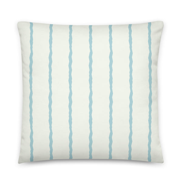 This Mid-Century Modern style scatter cushion consists of jagged vertical seafoam blue stripes against a pale cream background