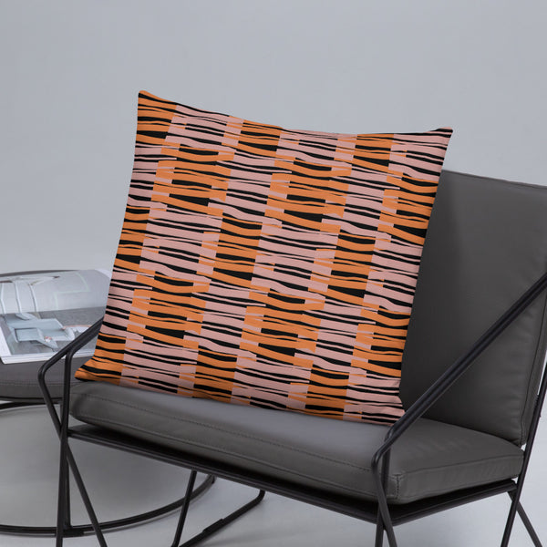 Orange and pink criss-cross fibres alternate in a checked pattern with a black background in this sofa pillow cushion by BillingtonPix