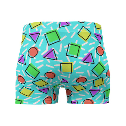 Retro style 80s Memphis design boxer briefs with colourful rainbow primary colors in geometric shapes squares, circles. triangles with a random white pattern below all over a turquoise blue background on this best men's boxer briefs by BillingtonPix