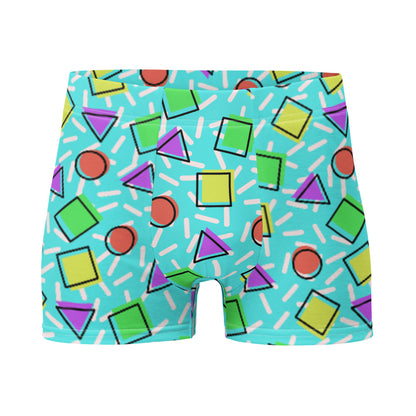 Retro style 80s Memphis design boxer briefs with colourful rainbow primary colors in geometric shapes squares, circles. triangles with a random white pattern below all over a turquoise blue background on this best men's boxer briefs by BillingtonPix