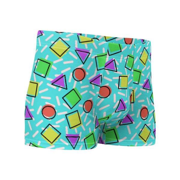 Retro style 80s Memphis design boxer briefs with colourful rainbow primary colors in geometric shapes squares, circles. triangles with a random white pattern below all over a turquoise blue background on this best men's boxer briefs by BillingtonPix