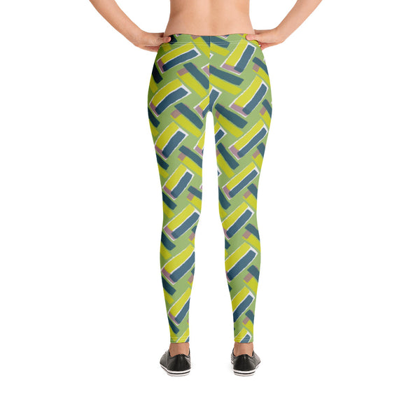 The vintage style graphic design printed on the front of these patterned leggings consists of diagonal color blocks in an alternating criss-cross format on a green background