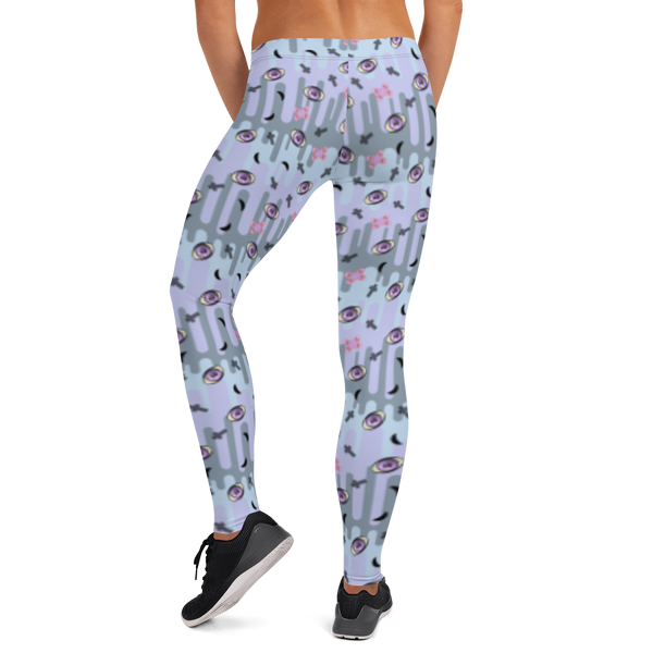 Pastel goth design harajuku leggings for women with a spooky pattern of eyeballs, crosses and black moons against a pastel drip design on these festival pants or running tights for women by BillingtonPix