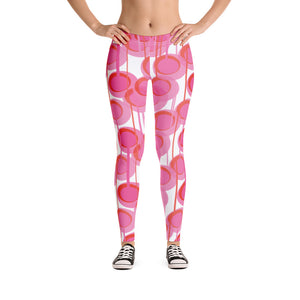 These Mid-Century Modern style leggings / yoga pants consist of colorful geometric circular shapes in various tones of pink, connected vertically by narrow tentacles to form an almost hanging mobile type abstract circular pattern on a white background