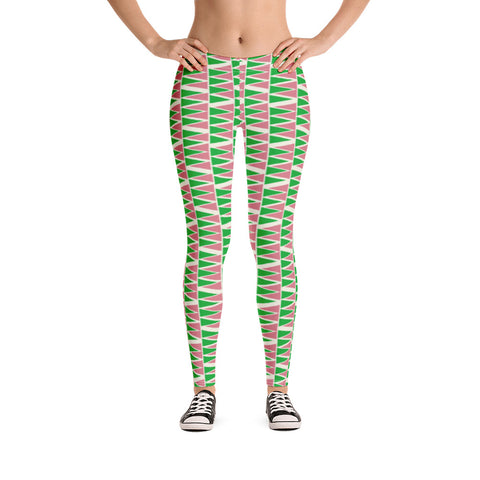 The vintage mid century modern style graphic design printed onto these colorful leggings consists of a geometric triangular pattern in green and pink on a cream background