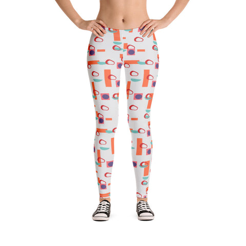 The vintage mid century modern style graphic design printed onto these all over print leggings consists of colourful geometric shapes in orange, turquoise, red and purple against a soft stone coloured background
