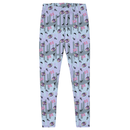 Pastel goth design harajuku leggings for women with a spooky pattern of eyeballs, crosses and black moons against a pastel drip design on these festival pants or running tights for women by BillingtonPix